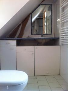 Virtuvė arba virtuvėlė apgyvendinimo įstaigoje La Petite Maison arc-en-ciel