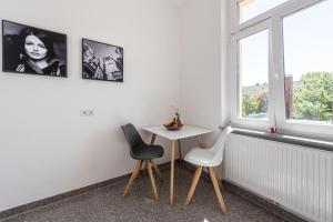 Ein Sitzbereich in der Unterkunft Family-Apartments Freiburg