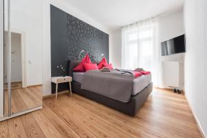 Ein Bett oder Betten in einem Zimmer der Unterkunft Family-Apartments Freiburg