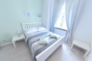 Posteľ alebo postele v izbe v ubytovaní Apartamenty Zamkowa