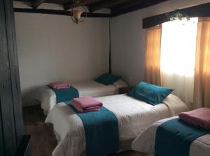 Un ou plusieurs lits dans un hébergement de l'établissement Samay Kirutoa Lodge