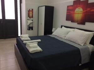 Posteľ alebo postele v izbe v ubytovaní La Maison di Angela