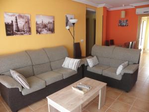 a living room with a couch and a coffee table at Naturaleza y Golf in San Jorge
