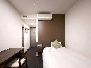 Postel nebo postele na pokoji v ubytování Hotel Crown Hills Ueno Premier