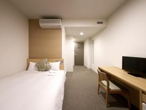 Postel nebo postele na pokoji v ubytování Hotel Crown Hills Ueno Premier
