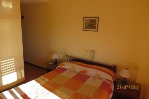 Ein Bett oder Betten in einem Zimmer der Unterkunft Hotel Carilo