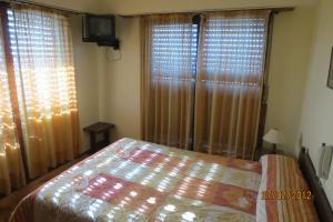 Łóżko lub łóżka w pokoju w obiekcie Hotel Carilo