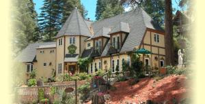 a large house with a landscaping in front of it at FLEUR DE LAC EUROPERAN INn in Lake Arrowhead