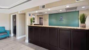 a lobby of a hospital with a reception counter at Best Western Inn Florence in Florence +12 photos