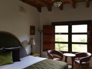Cama o camas de una habitación en Hotel Mansion Real