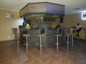 The lounge or bar area at Rocha's Hotel