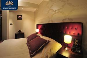 Łóżko lub łóżka w pokoju w obiekcie Hotel Villa Bolestraszyce
