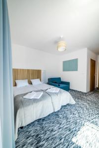 Postel nebo postele na pokoji v ubytování WYDMA Resort Medi & SPA - Normobaria