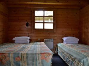Postel nebo postele na pokoji v ubytování Camping Männisalu