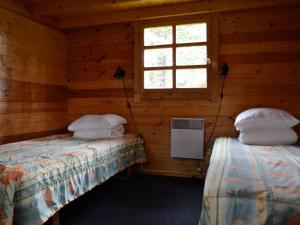 Postel nebo postele na pokoji v ubytování Camping Männisalu