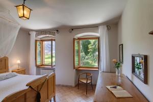 Postel nebo postele na pokoji v ubytování Agriturismo Maso Lizzone