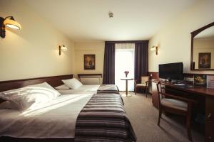 Łóżko lub łóżka w pokoju w obiekcie Hotel Great Polonia Conrad Kraków