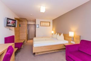 Posteľ alebo postele v izbe v ubytovaní Hotel Bacher Asitzstubn