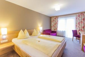 Posteľ alebo postele v izbe v ubytovaní Hotel Bacher Asitzstubn