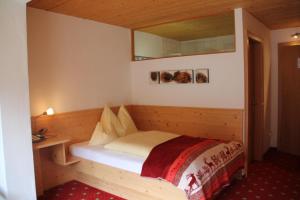 Postel nebo postele na pokoji v ubytování Boutiquehotel Grandau