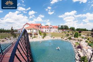 a large house with a swimming pool in a yard at Villa Bolestraszyce in Przemyśl
