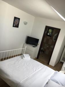 Postel nebo postele na pokoji v ubytování Vila Ann