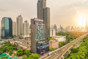 an aerial view of a city with tall buildings at Mercure Bangkok Makkasan in Bangkok