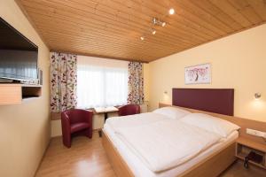 A bed or beds in a room at Kärntner Stubn