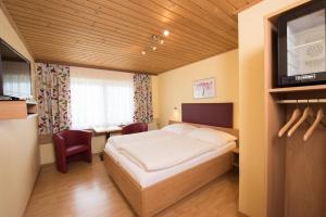 A bed or beds in a room at Kärntner Stubn
