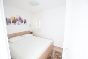Postel nebo postele na pokoji v ubytování Apartman Roza