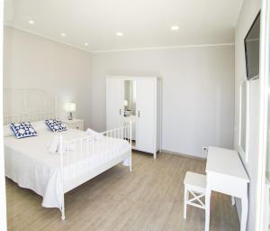 A bed or beds in a room at Ciao Ciao Rooms