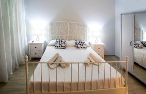 A bed or beds in a room at Ciao Ciao Rooms