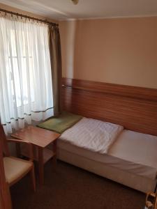Łóżko lub łóżka w pokoju w obiekcie Villa Nina
