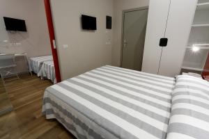 Postel nebo postele na pokoji v ubytování Hotel Aurea