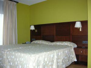 Postel nebo postele na pokoji v ubytování Hotel De Rei