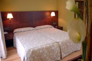 Postel nebo postele na pokoji v ubytování Hotel De Rei