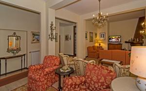 TV a/nebo společenská místnost v ubytování Hotel Rialto Suisse