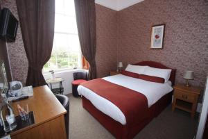 מיטה או מיטות בחדר ב-The Southfield Hotel