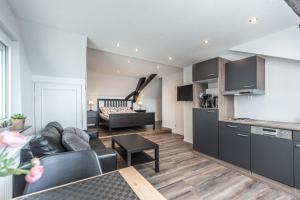 a living room with a couch and a table at Ferienwohnung Kopf in Bad Buchau