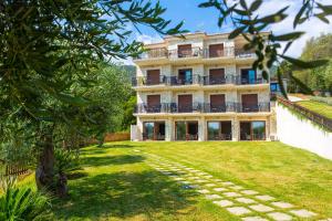 an external view of the villa with a garden at Pelagos in Parga