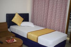 Llit o llits en una habitació de Hotel Marine Plaza