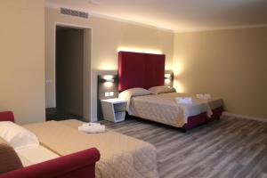 Postel nebo postele na pokoji v ubytování Alma Living Hotel- Al Girarrosto