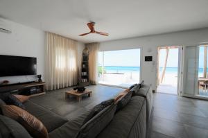 A seating area at Amani Home - Moja Private Beach Suite