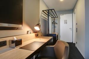 TV a/nebo společenská místnost v ubytování NYCE Hotel Dortmund City
