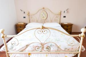 Postel nebo postele na pokoji v ubytování Agriturismo La Corte del Lupo