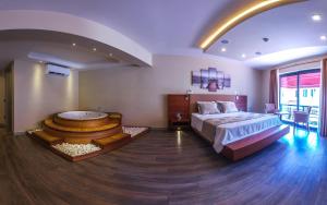 A bed or beds in a room at Göcek Centre Hotel