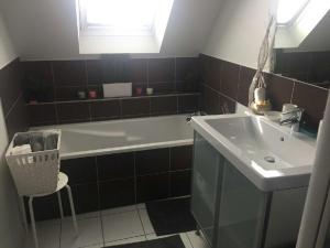 a bathroom with a sink, toilet and bathtub at Appartement avec garage Colmar Centre Historique in Colmar
