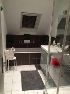 a bathroom with a sink, toilet, and bathtub at Appartement avec garage Colmar Centre Historique in Colmar