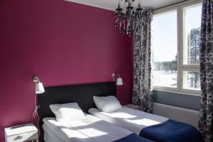 Кровать или кровати в номере Lapin Satu