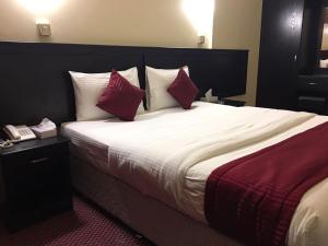 Postelja oz. postelje v sobi nastanitve Simba Hotel